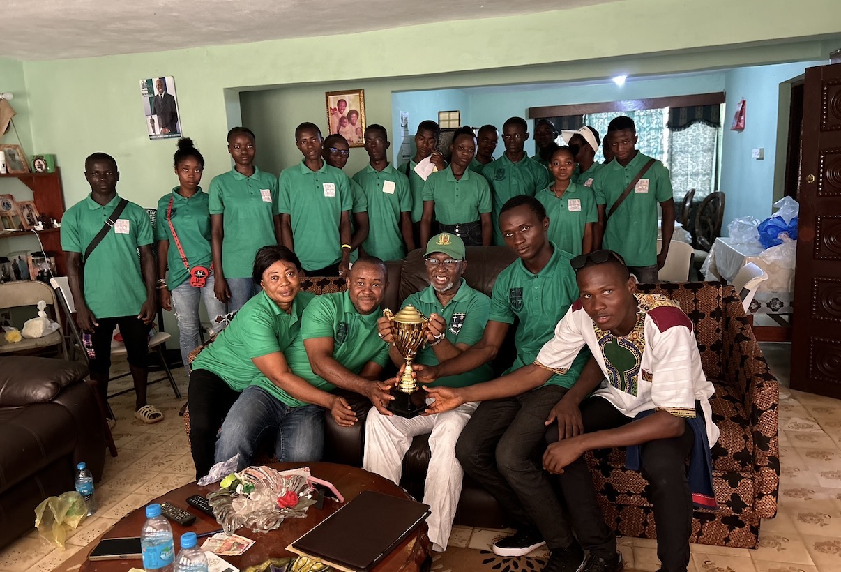 Wurie Foundation community gathering with trophy